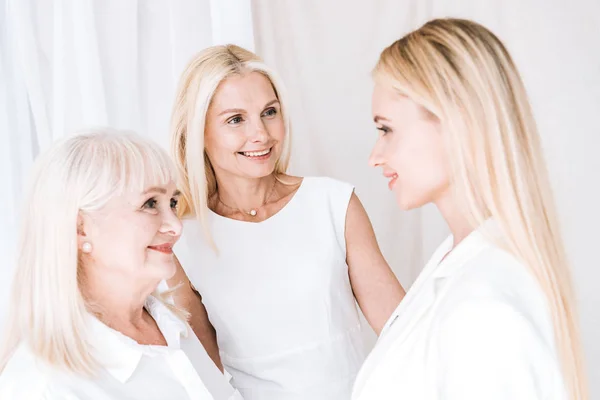 Elegant Three Generation Blonde Women Total White Outfits Looking Each — Stock Photo, Image