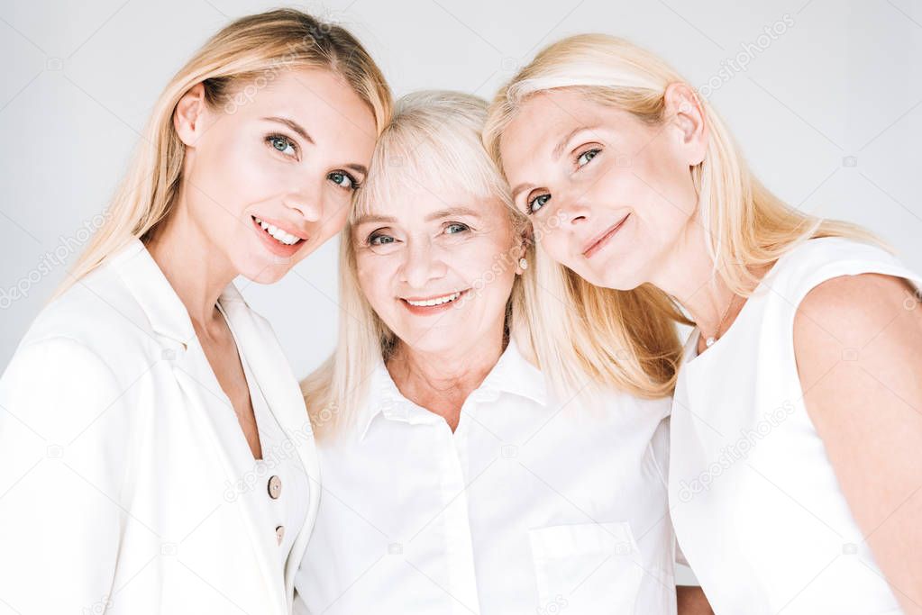 three generation blonde beautiful women isolated on grey