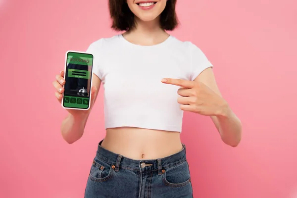 Cropped View Girl Pointing Finger Smartphone Booking App Isolated Pink — Stock Photo, Image