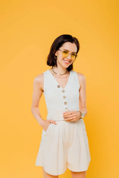 Smiling Stylish Woman Sunglasses Posing Hand Pocket Isolated Yellow — Stock Photo, Image