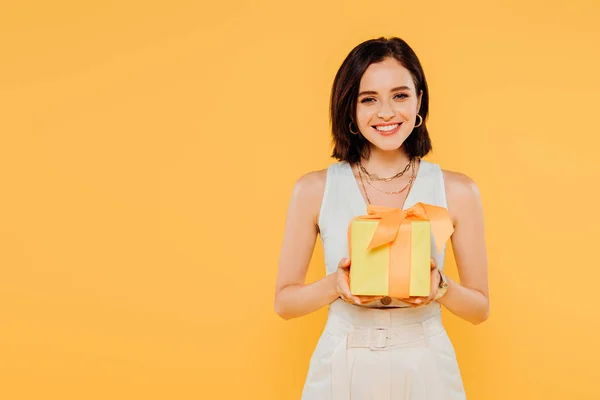 Happy Smiling Girl Holding Gift Box Isolated Yellow — Stock Photo, Image