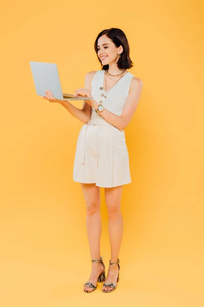 Full Length View Smiling Elegant Girl Laptop Isolated Yellow — Stock Photo, Image