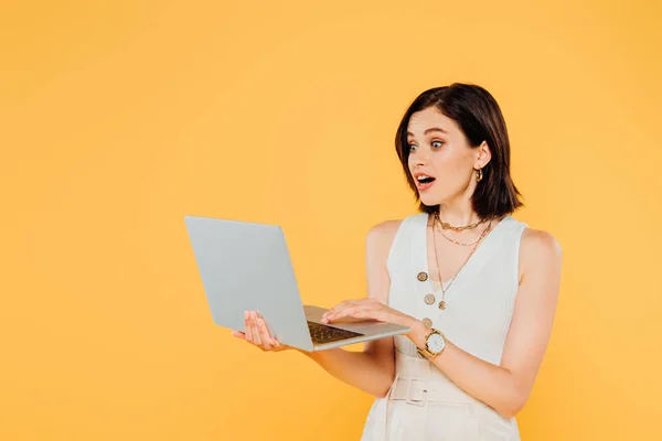 Shocked Elegant Girl Laptop Isolated Yellow — стоковое фото