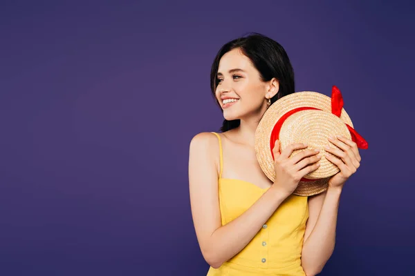 Smiling Pretty Girl Holding Straw Hat Looking Away Isolated Purple — Stock Photo, Image