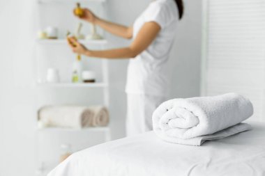 selective focus of white towel on massage mat in spa  clipart