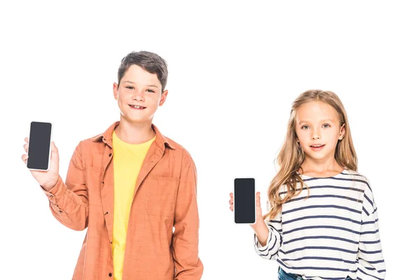 Front View Two Smiling Kids Holding Smartphones Blank Screen Isolated — Stock Photo, Image