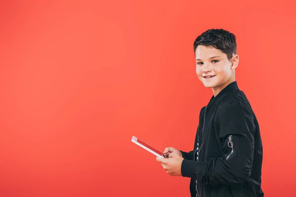 Smiling Kid Jacket Using Digital Tablet Isolated Red — Stock Photo, Image