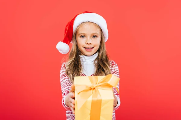 Front View Smiling Kid Santa Hat Holding Present Isolated Red — Stock Photo, Image