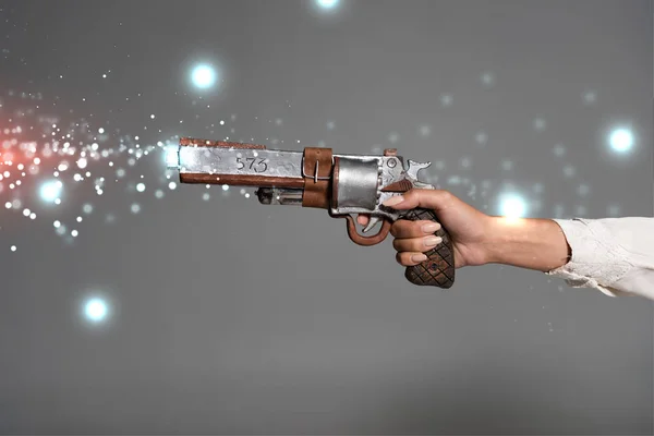 stock image cropped view of woman holding vintage revolver isolated on grey