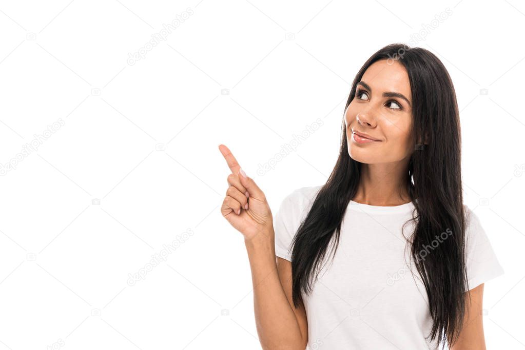 cheerful woman pointing with finger isolated on white 