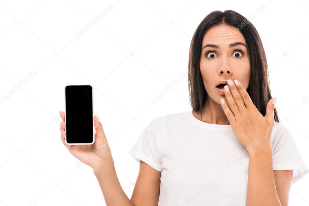 shocked woman holding smartphone with blank screen isolated on white 