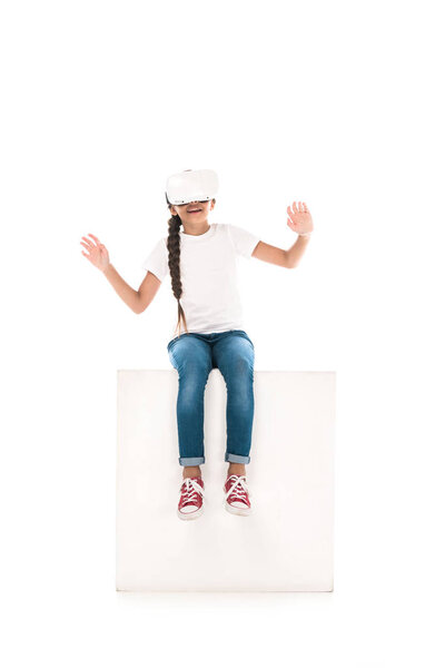 happy kid gesturing while wearing virtual reality headset isolated on white 
