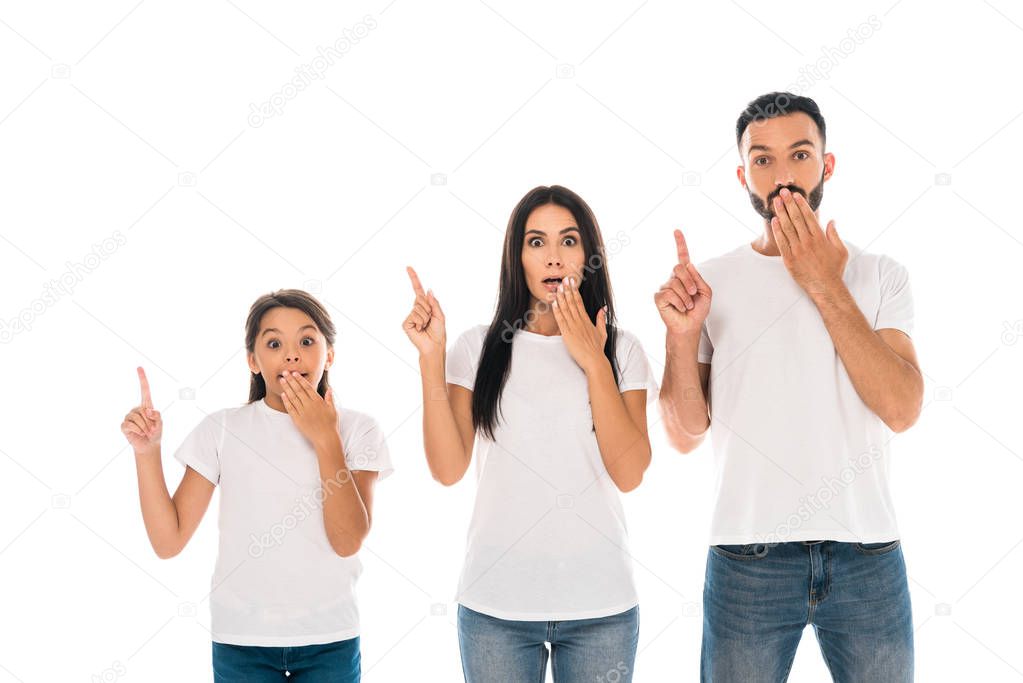 surprised parents and kid covering faces and pointing with fingers isolated on white 