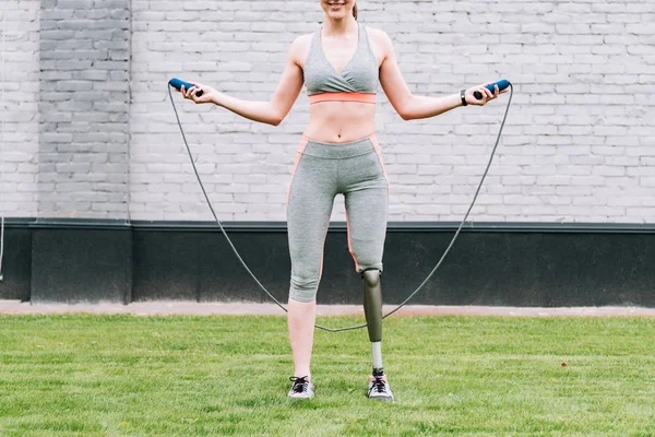 Partial View Smiling Disabled Sportswoman Jump Rope Grass — ストック写真