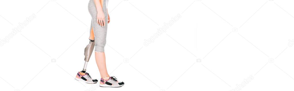 panoramic shot of disabled sportswoman with prosthetic leg isolated on white