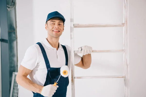 Handsome Young Painter Uniform Smiling Camera While Standing Ladder Holding — Stock Photo, Image