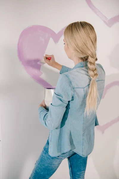 Young Woman Drawing Pink Heart Wall Paintbrush — Stock Photo, Image