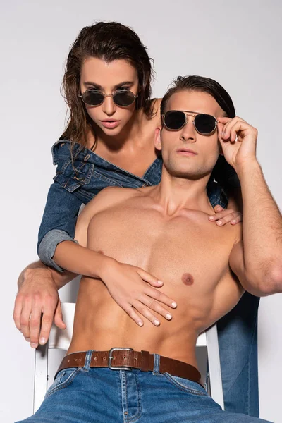 Trendy Muscular Man Touching Sunglasses Attractive Woman White — Stock Photo, Image