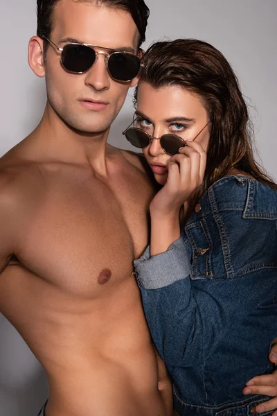 Stylish Girl Touching Sunglasses Muscular Boyfriend White — Stock Photo, Image