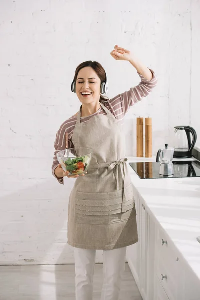 Happy Young Woman Headphones Dancing Singing While Holding Bowl Salad — Stock Photo, Image