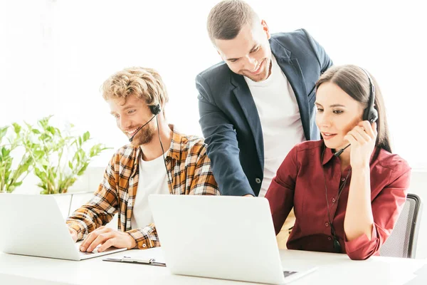 Cheerful Broker Standing Operators Headsets Call Center — Stock Photo, Image