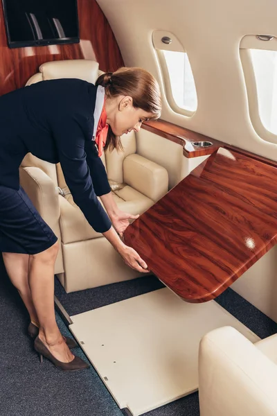 Flight Attendant Uniform Holding Wooden Tabke Private Plane — Stock Photo, Image