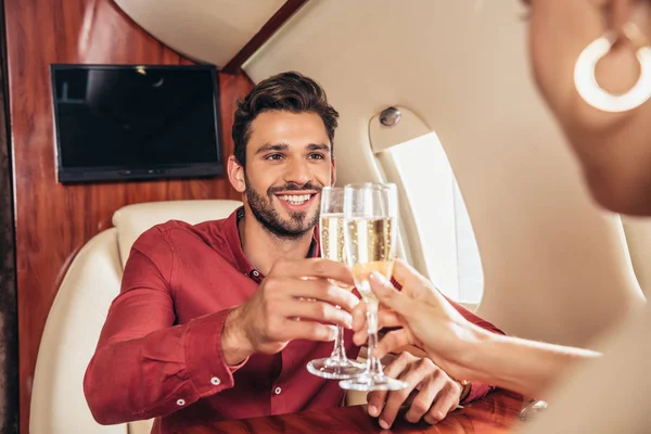 Smiling Boyfriend Girlfriend Clinking Champagne Glasses Private Plane — Stock Photo, Image