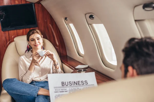 Selective Focus Boyfriend Reading Newspaper Girlfriend Holding Cup Private Plane — Stock Photo, Image