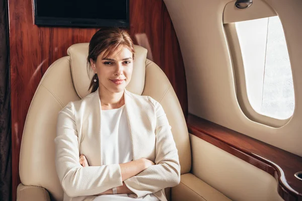 Attractive Businesswoman Suit Crossed Arms Looking Camera Private Plane — Stock Photo, Image