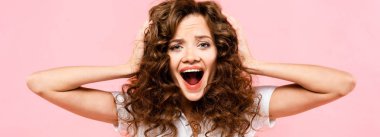 beautiful angry curly girl shouting isolated on pink clipart