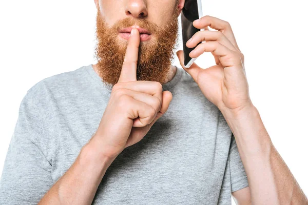 Vista Recortada Del Hombre Barbudo Hablando Teléfono Inteligente Mostrando Símbolo —  Fotos de Stock