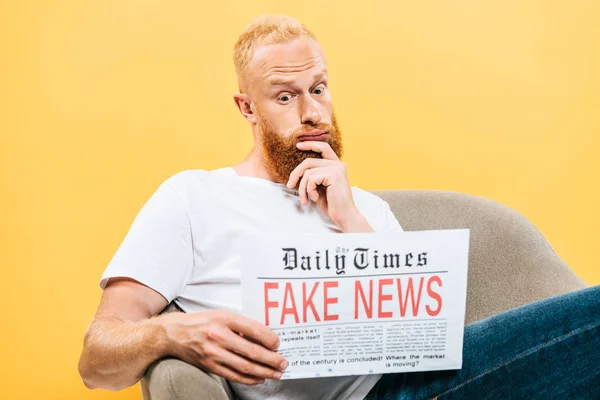Thoughtful Man Reading Newspaper Fake News While Sitting Armchair Isolated — Stock Photo, Image