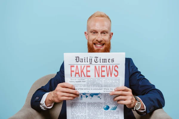 Smiling Bearded Businessman Reading Newspaper Fake News While Sitting Armchair — Stock Photo, Image