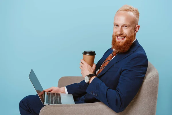 Bearded Businessman Coffee Using Laptop While Sitting Armchair Isolated Blue — Stock Photo, Image