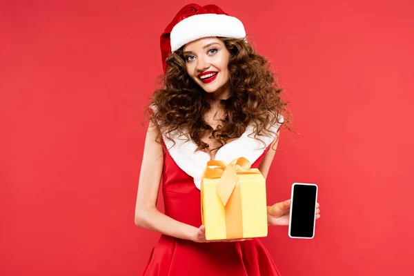 Attractive Smiling Girl Santa Costume Holding Christmas Gift Smartphone Blank — Stock Photo, Image