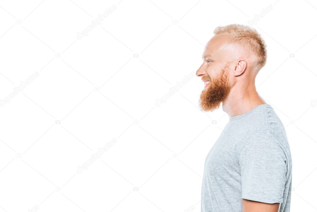profile portrait of handsome cheerful man in grey t-shirt, isolated on white