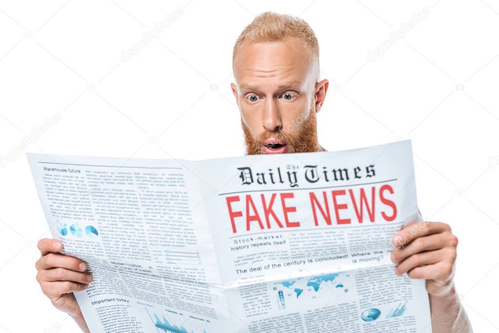 surprised bearded man reading newspaper with fake news, isolated on white