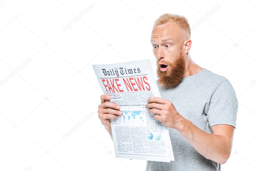 shocked bearded man reading newspaper with fake news, isolated on white