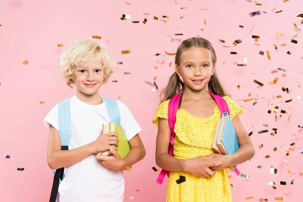 Smiling Schoolchildren Backpacks Holding Books Falling Confetti — Stock Photo, Image
