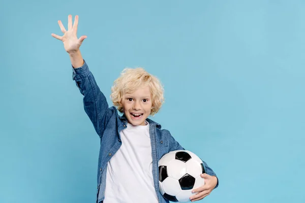 Smiling Cute Kid Outstretch Hand Looking Camera Holding Football Isolated — Stock Photo, Image