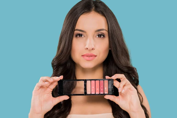 Attractive Woman Holding Lip Gloss Palette Isolated Blue — ストック写真