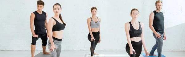 Panoramic Shot Five Young People Practicing Yoga Crescent Lunge Pose — Stock Photo, Image