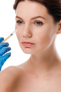 cropped view of plastic surgeon in latex glove holding syringe near attractive naked girl isolated on white  clipart