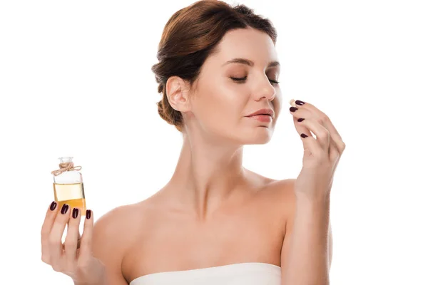 Happy Woman Holding Glass Bottle Smelling Perfume Isolated White — ストック写真