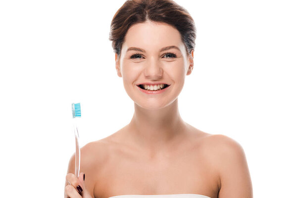 happy young woman holding toothbrush isolated on white 