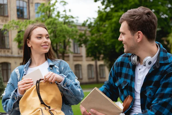 Cheerful Girl Putting Book Backpack Looking Happy Student — Stock Photo, Image