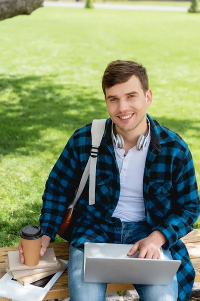 Happy Student Using Laptop Holding Paper Cup While Sitting Bench — Stock Photo, Image