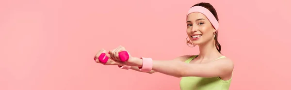 Panoramic Shot Smiling Sportswoman Outstretched Hands Exercising Dumbbells Isolated Pink — Stock Photo, Image