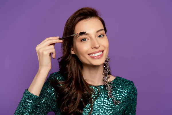 Happy Woman Holding Eyebrow Brush While Styling Eyebrow Isolated Purple — Stock Photo, Image