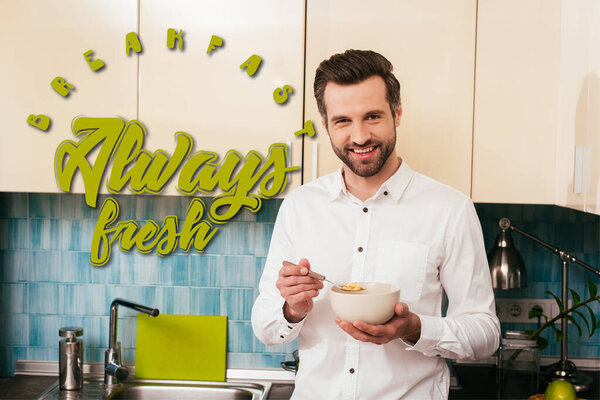 Handsome man smiling at camera while eating cereals in kitchen, breakfast always fresh illustration
